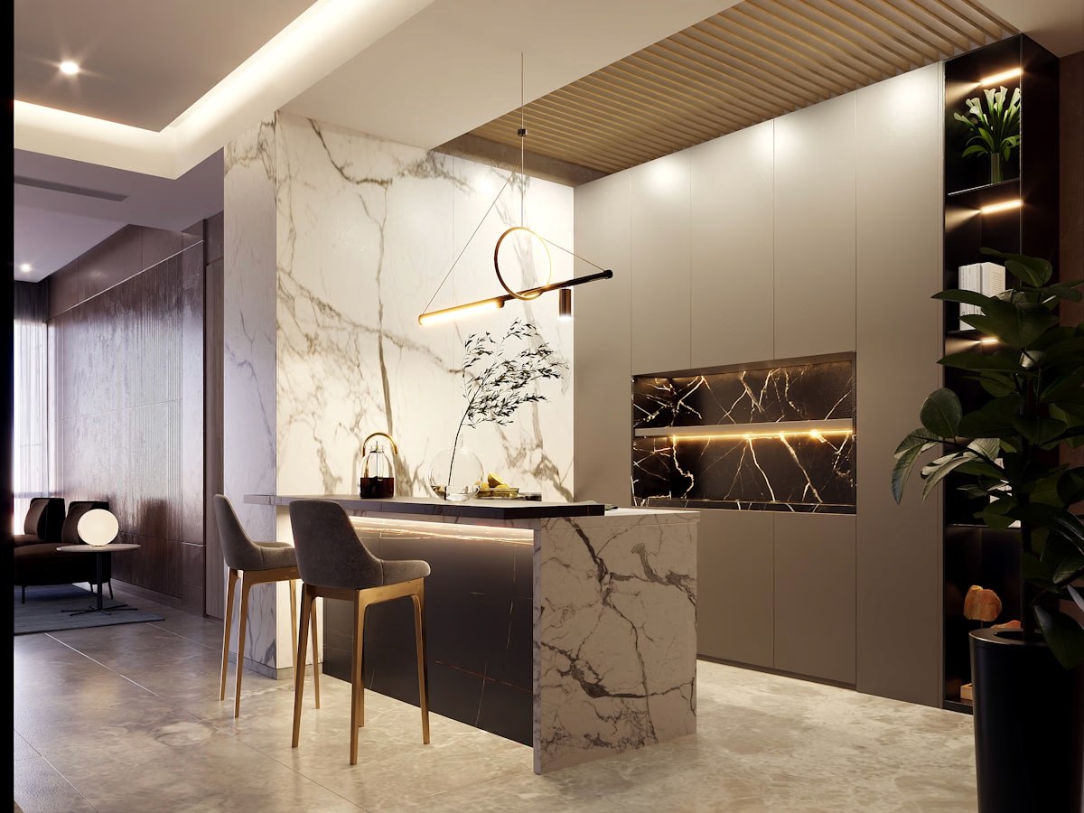 Cocina con isla de mármol y detalles en dorado